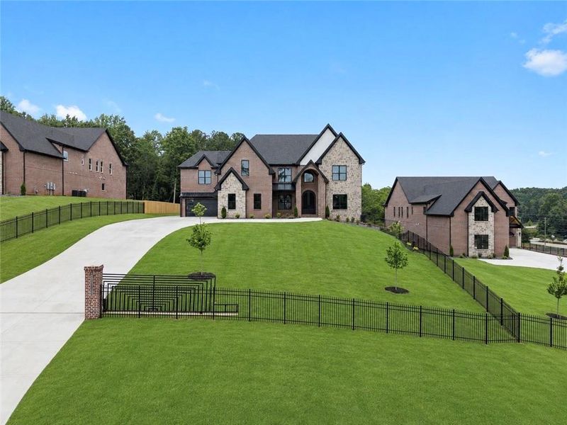 Front exterior of a new home in , Buford, GA, highlighting curb appeal (Image 32). Front exterior of a new home in , Buford, GA, highlighting curb appeal (Image 32).