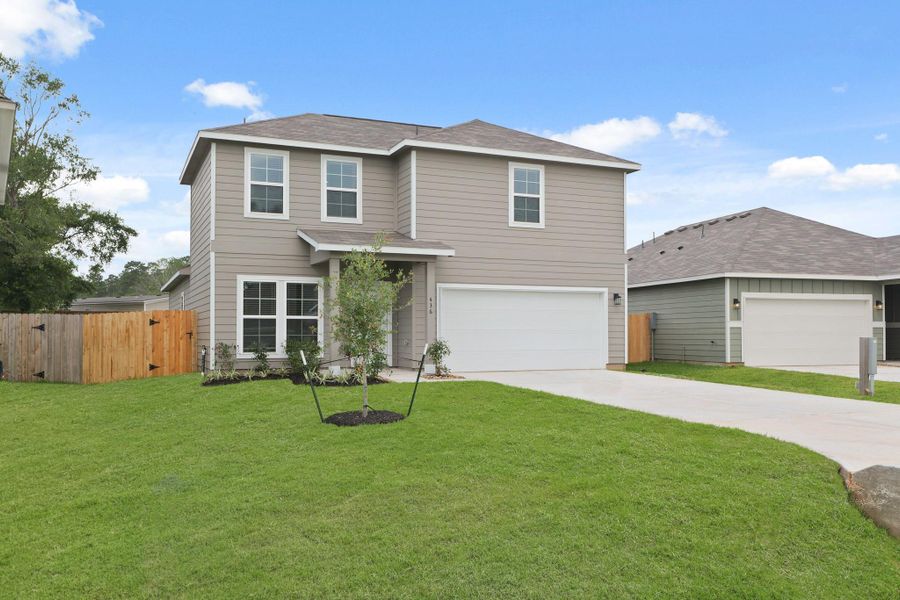 Front exterior of a new home in Lakes at Crockett Martin, Conroe, TX, highlighting curb appeal (Image 2). Front exterior of a new home in Lakes at Crockett Martin, Conroe, TX, highlighting curb appeal (Image 2).