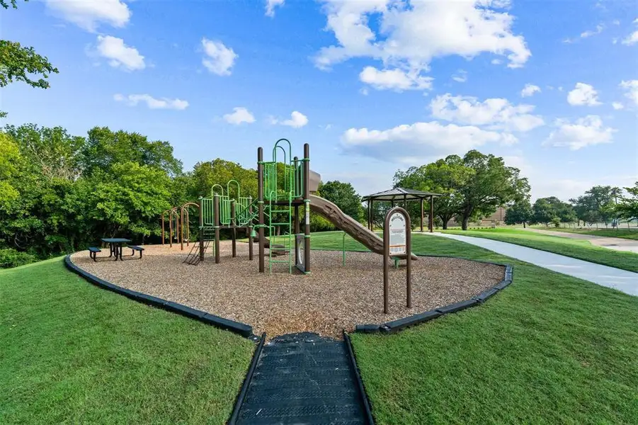 Community play area with a yard and a gazebo Community play area with a yard and a gazebo
