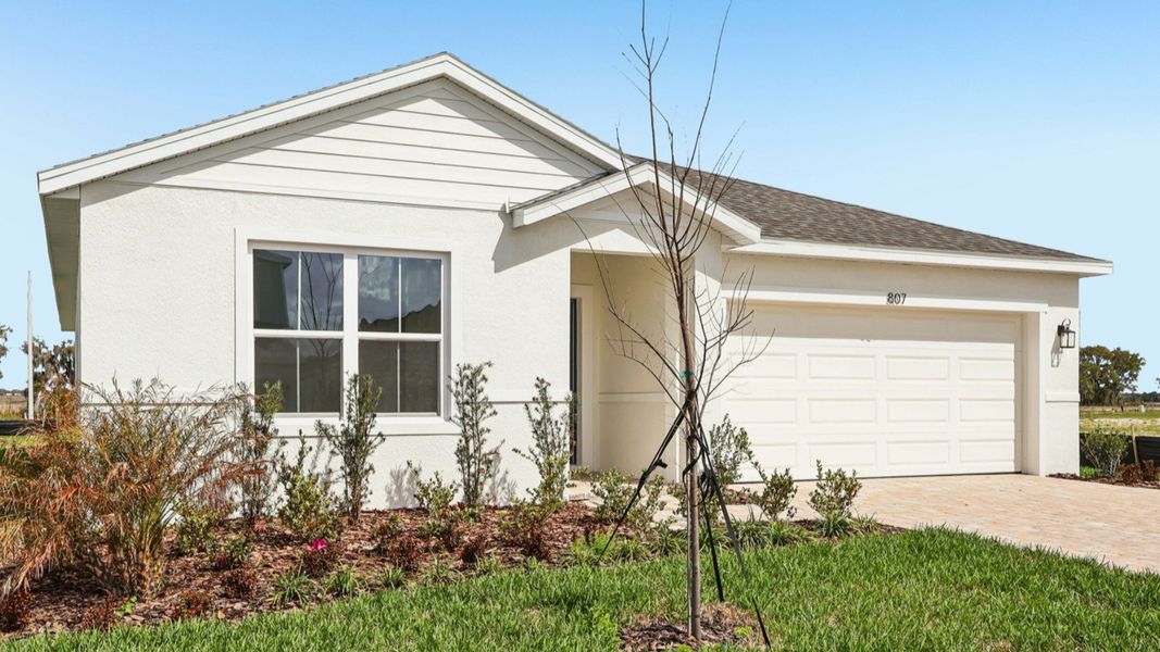 Representative exterior photo of a completed home built from the Baker by DRB Homes in Willowbrook North, Winter Haven, FL (Image 25).