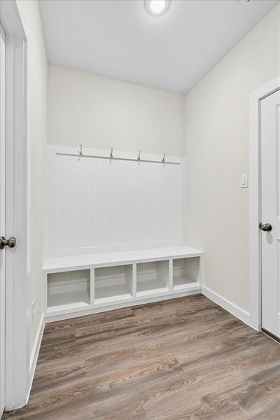 Mudroom featuring luxury vinyl flooring