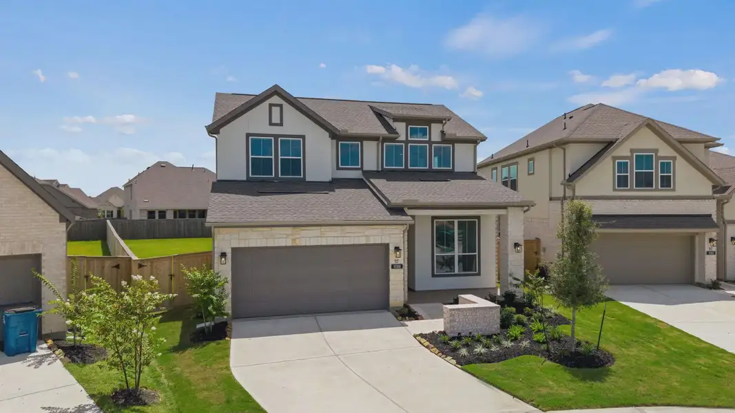 Front exterior of a new home in Lariat, Liberty Hill, TX, highlighting curb appeal (Image 2). Front exterior of a new home in Lariat, Liberty Hill, TX, highlighting curb appeal (Image 2).