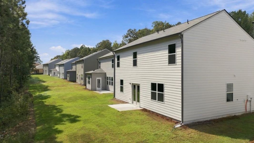 Exterior details and patio area of a home in Oaks at Cedar Grove, Fairburn (Image 3).