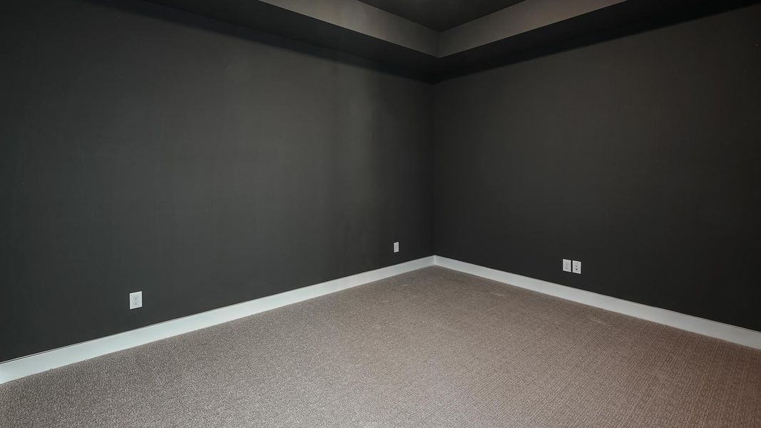 Spare room featuring baseboards and light colored carpet Spare room featuring baseboards and light colored carpet
