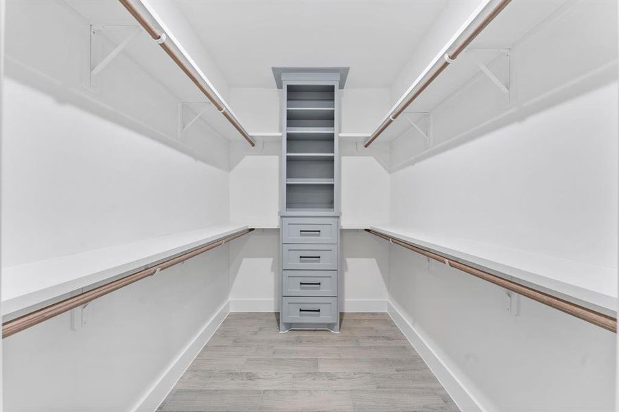 A generous walk-in closet located in the primary bedroom, providing plenty of storage space for your wardrobe.