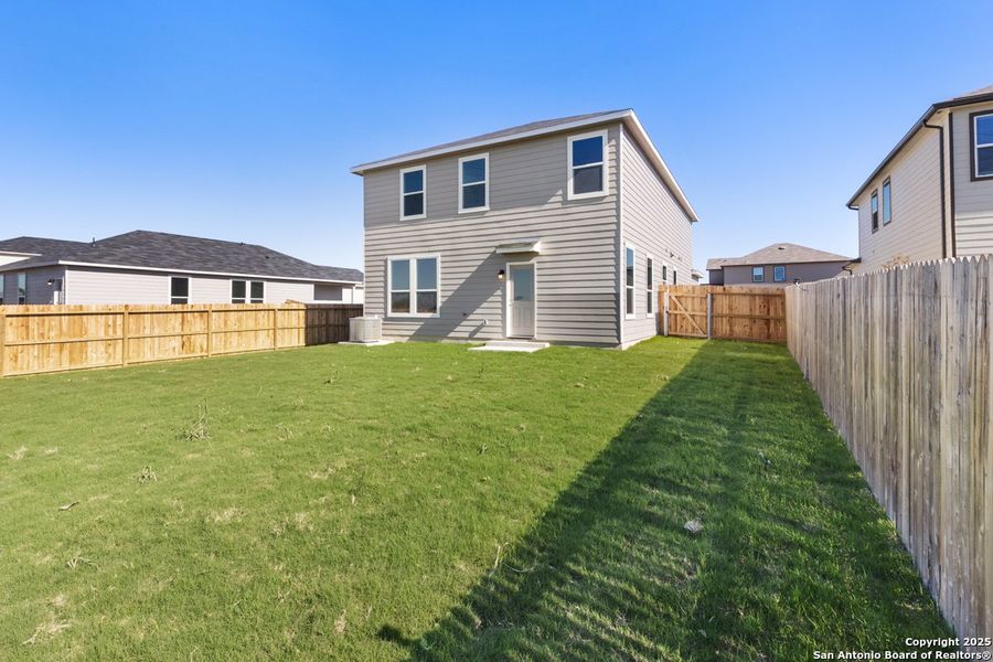 Exterior details and patio area of a home in Woodside Farms, Seguin (Image 3).