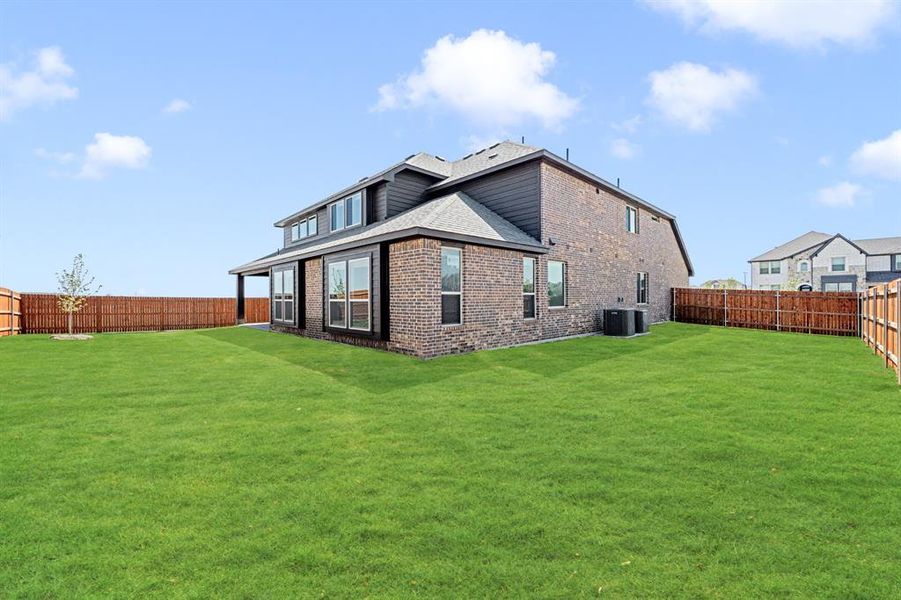 Front exterior of a new home in The Oasis at North Grove 75-80, Waxahachie, TX, highlighting curb appeal (Image 26). Front exterior of a new home in The Oasis at North Grove 75-80, Waxahachie, TX, highlighting curb appeal (Image 26).