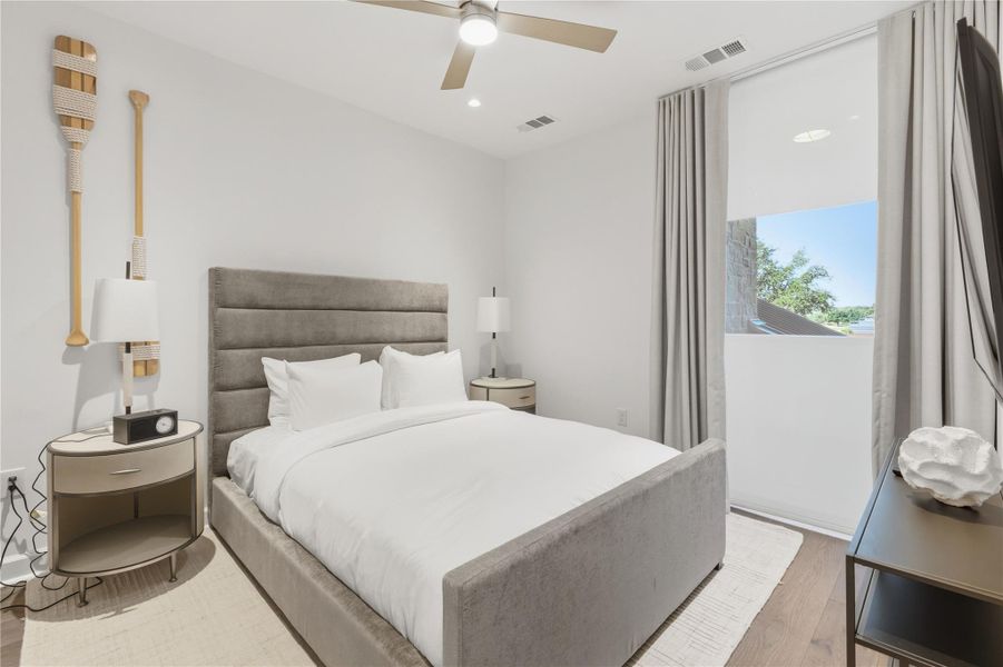 Bedroom featuring wood finished floors, recessed lighting, and a ceiling fan