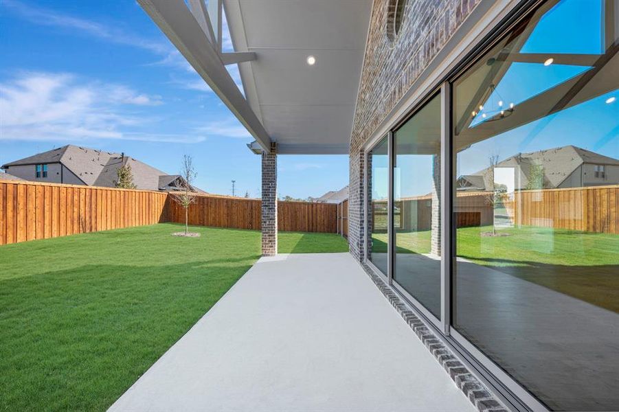 Exterior details and patio area of a home in Kreymer at the Park, Wylie (Image 24). Exterior details and patio area of a home in Kreymer at the Park, Wylie (Image 24).