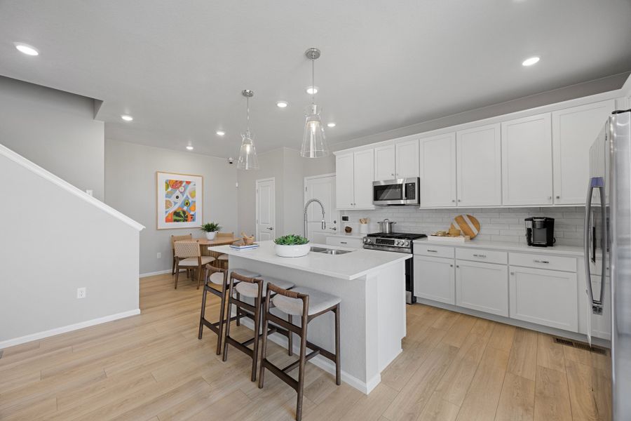 Representative furnished interior of a home built from the 2504 by Risewell Homes in Harvest Crossing, Aurora (Image 8).