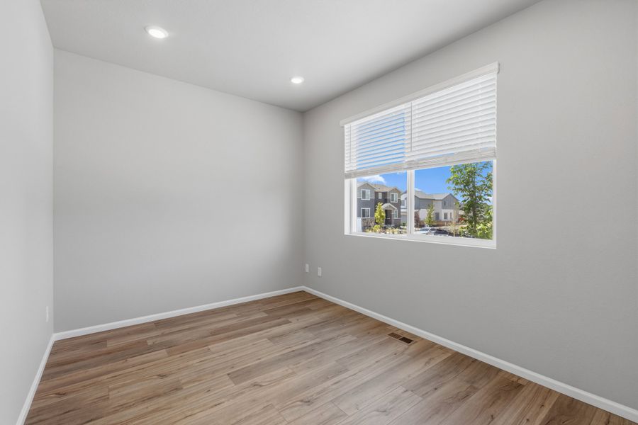 Spacious, unfurnished interior of a new home in Woodrose at Painted Prairie, Aurora (Image 11).