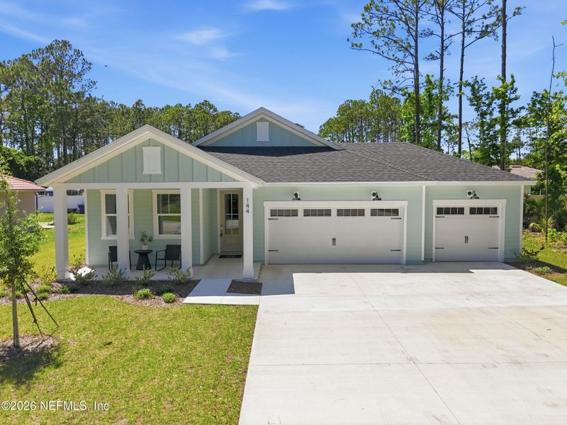 Front exterior of a new home in Palm Coast Homes, Palm Coast, FL, highlighting curb appeal (Image 27).
