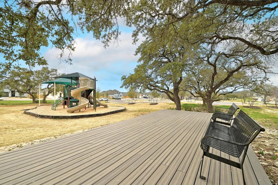 Shaded bench seating giveparents a place to catch up whilethe kids play.