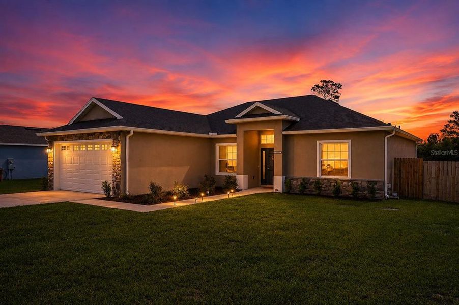 Front exterior of a new home in , Umatilla, FL, highlighting curb appeal (Image 24).