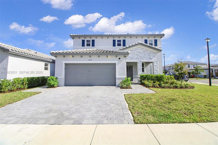 Front exterior of a new home in , Homestead, FL, highlighting curb appeal (Image 25). Front exterior of a new home in , Homestead, FL, highlighting curb appeal (Image 25).