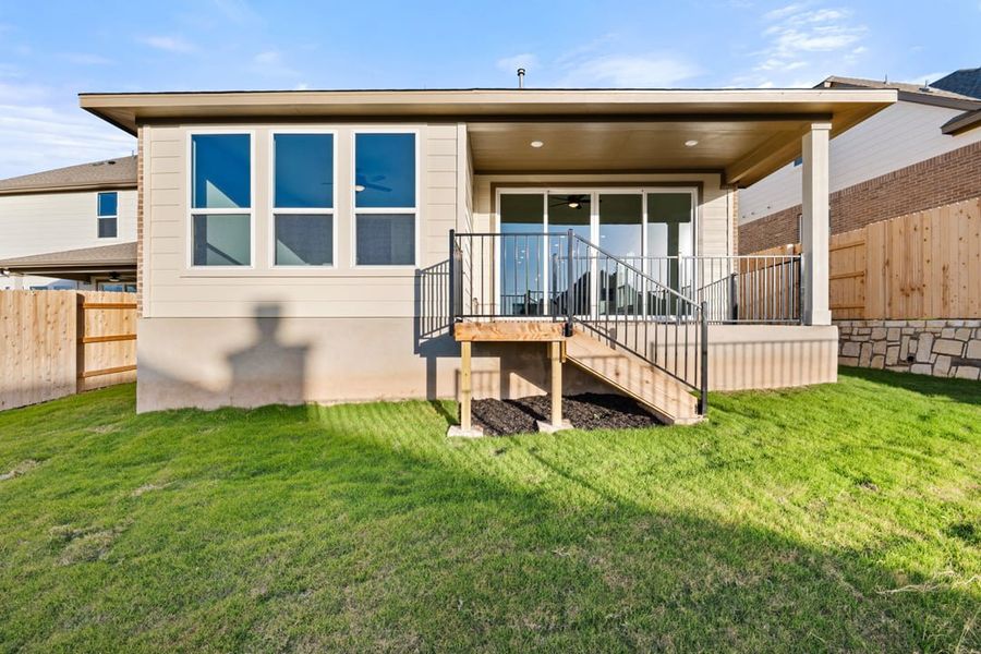 Exterior details and patio area of a home in Terrace Collection at Lariat, Liberty Hill (Image 29).