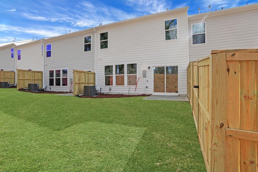 Exterior details and patio area of a home in Villas at Dawsonville Townhomes, Dawsonville (Image 4).