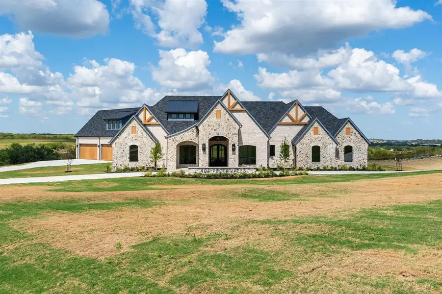Front exterior of a new home in , Aledo, TX, highlighting curb appeal (Image 2). Front exterior of a new home in , Aledo, TX, highlighting curb appeal (Image 2).