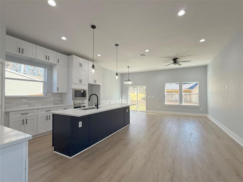 Formal Dining, Bright Living Area, and Casual Breakfast Space seamlessly blended in an open-concept design!