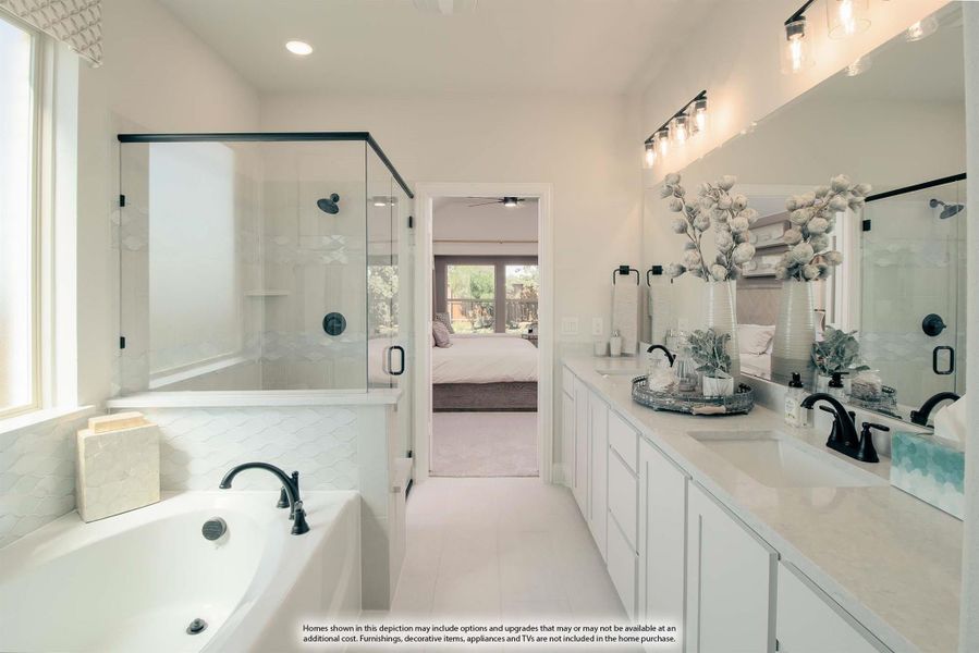 Master bathroom with soaking tub, glass walk-in shower, double vanity, and white cabinets