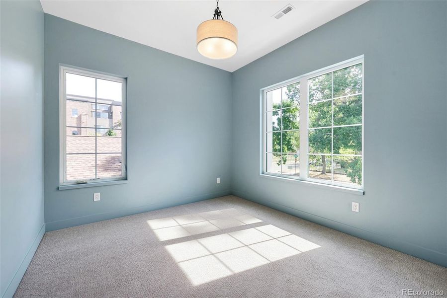 3rd of 3 bedrooms on upper level, en suite bath