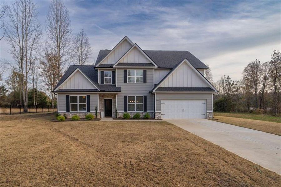 Front exterior of a new home in , Good Hope, GA, highlighting curb appeal (Image 1).