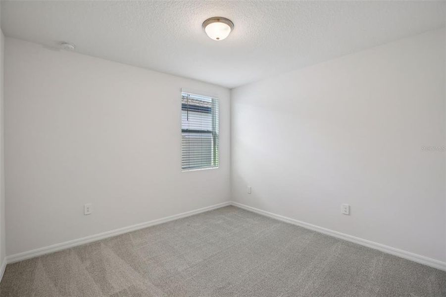 Spacious, unfurnished interior of a new home in Villamar - Signature Series, Winter Haven (Image 22).