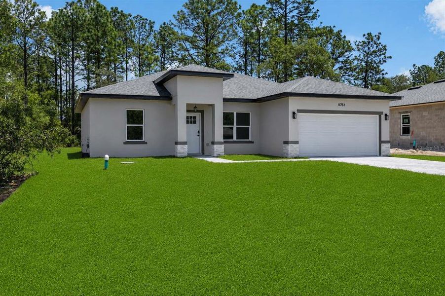 Front exterior of a new home in , Citrus Springs, FL, highlighting curb appeal (Image 23). Front exterior of a new home in , Citrus Springs, FL, highlighting curb appeal (Image 23).
