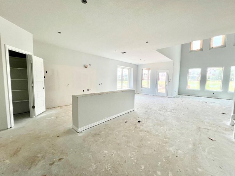 Unfurnished living room with unfinished concrete flooring Unfurnished living room with unfinished concrete flooring