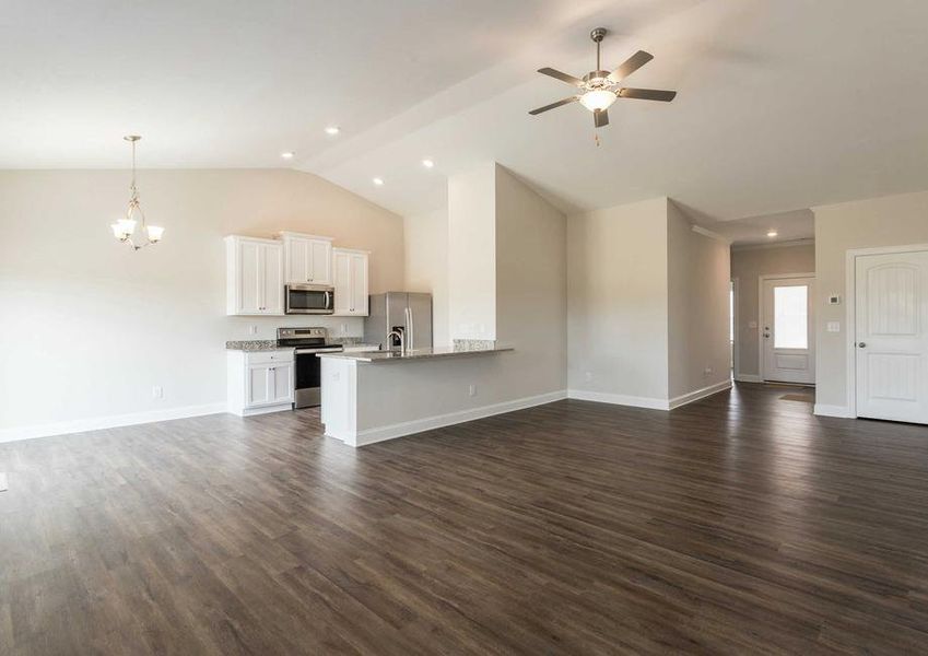 Alexander great room with ceiling fan, chandelier, and white finish kitchen