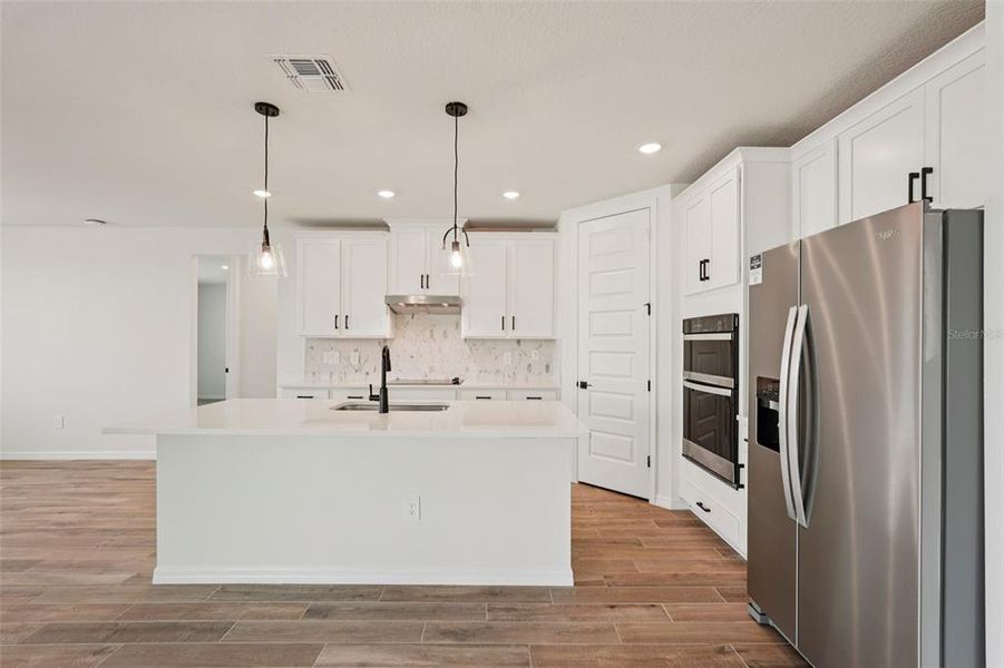 Furnished interior view inside a new home in Oakfield Trails - Signature Series, Parrish (Image 5).