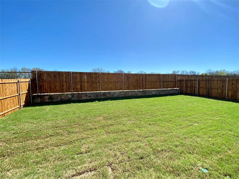 Fenced in back yard is a blank dlate for kids, dogs, and gardening Fenced in back yard is a blank dlate for kids, dogs, and gardening