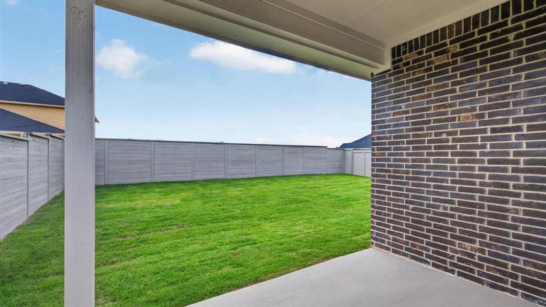 Exterior details and patio area of a home in Treeline, Justin (Image 2).