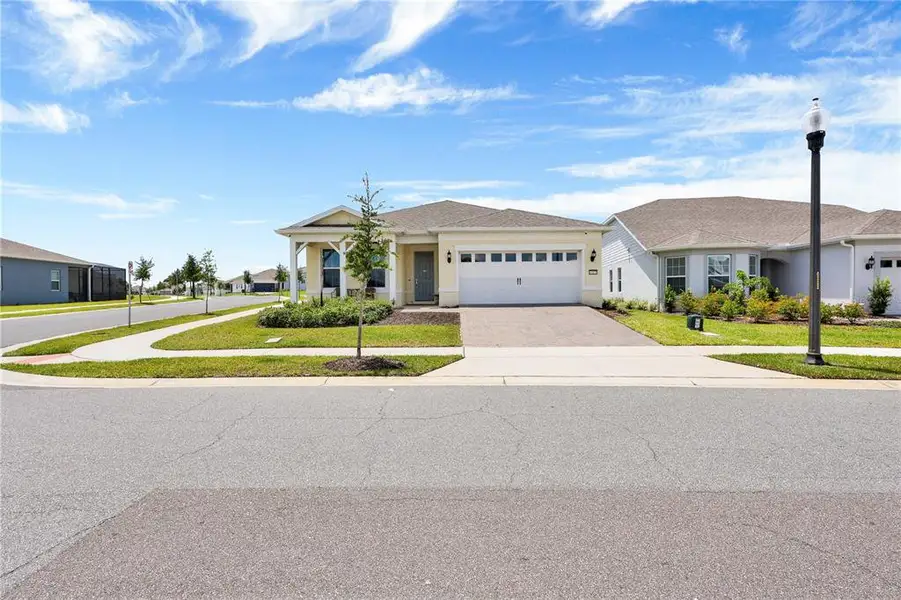 Front exterior of a new home in , Winter Garden, FL, highlighting curb appeal (Image 2).
