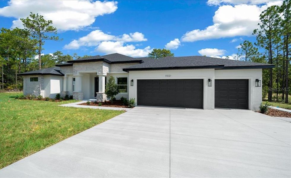 Front exterior of a new home in , Weeki Wachee, FL, highlighting curb appeal (Image 28). Front exterior of a new home in , Weeki Wachee, FL, highlighting curb appeal (Image 28).