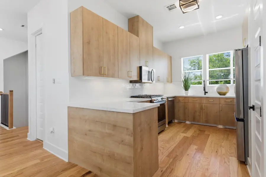 Stylish kitchen featuring sleek cabinetry, granite countertops, ample storage, and a functional layout ideal for everyday living.
