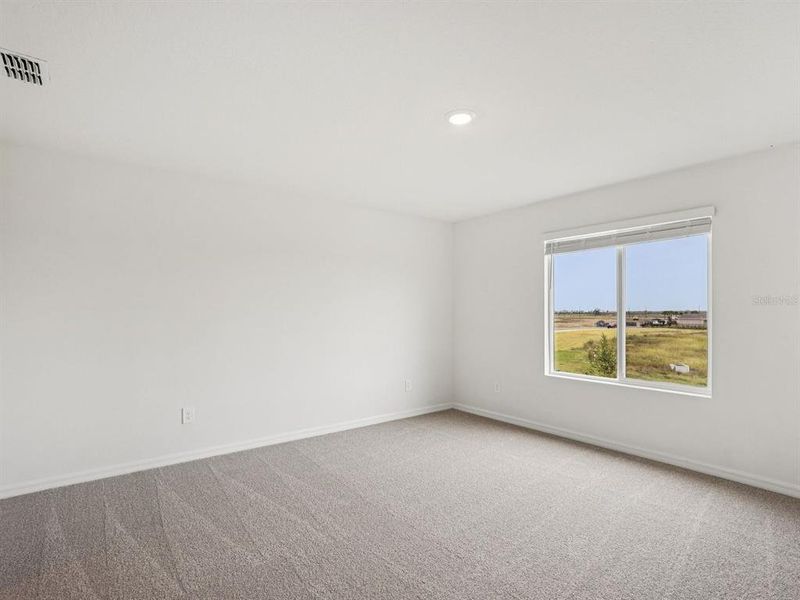 Spacious, unfurnished interior of a new home in Coasterra - Premier Series, Palmetto (Image 32).