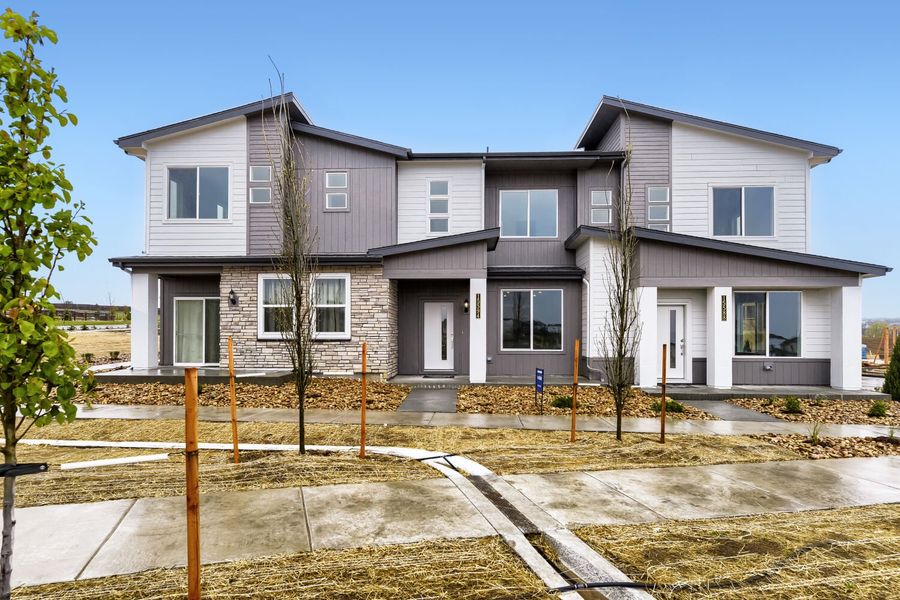 Front exterior of a new home in Newlin Crossing, Parker, CO, highlighting curb appeal (Image 1). Front exterior of a new home in Newlin Crossing, Parker, CO, highlighting curb appeal (Image 1).