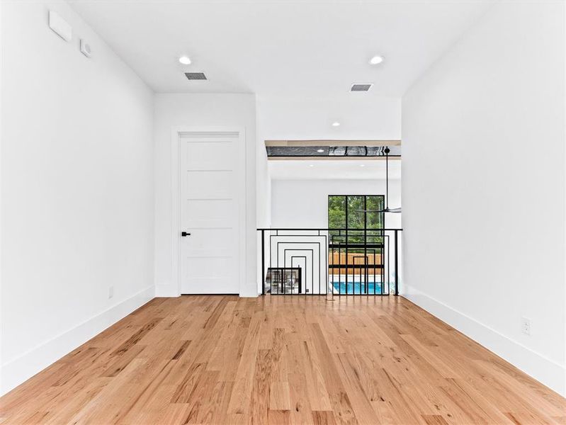 Spare room with light wood-type flooring