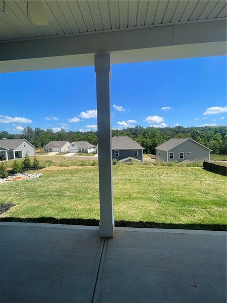 Exterior details and patio area of a home in Springwood Grove, Central (Image 3).