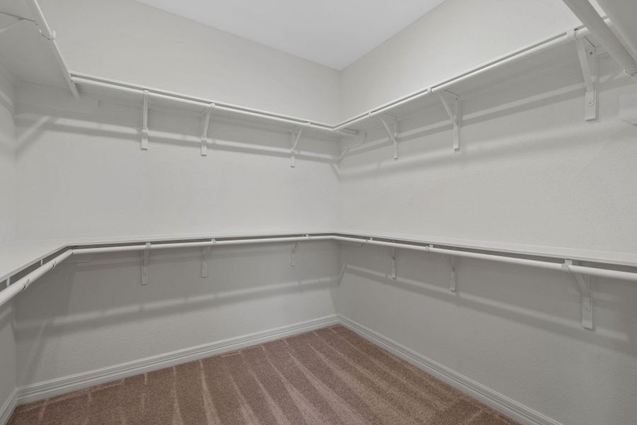 A view of your large primary walk-in Closet