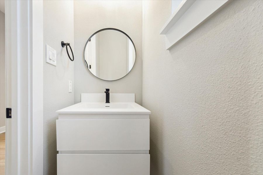 Powder bath adjacent to kitchen