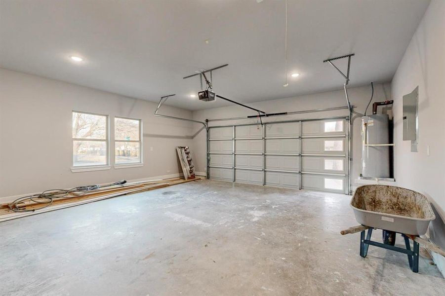 Garage with a garage door opener and electric panel