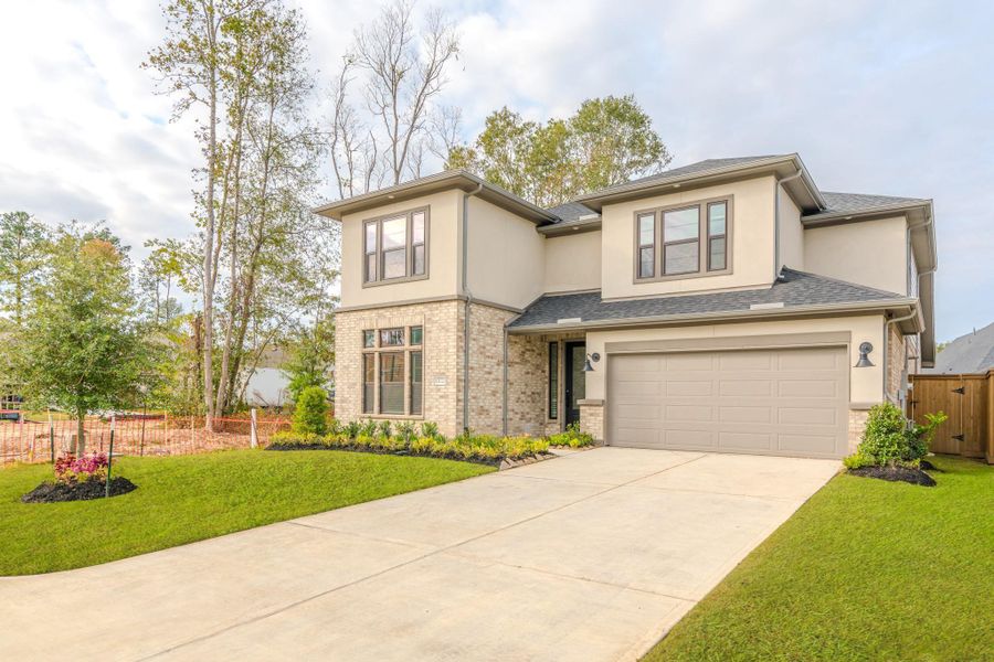 Front exterior of a new home in , Porter, TX, highlighting curb appeal (Image 22).