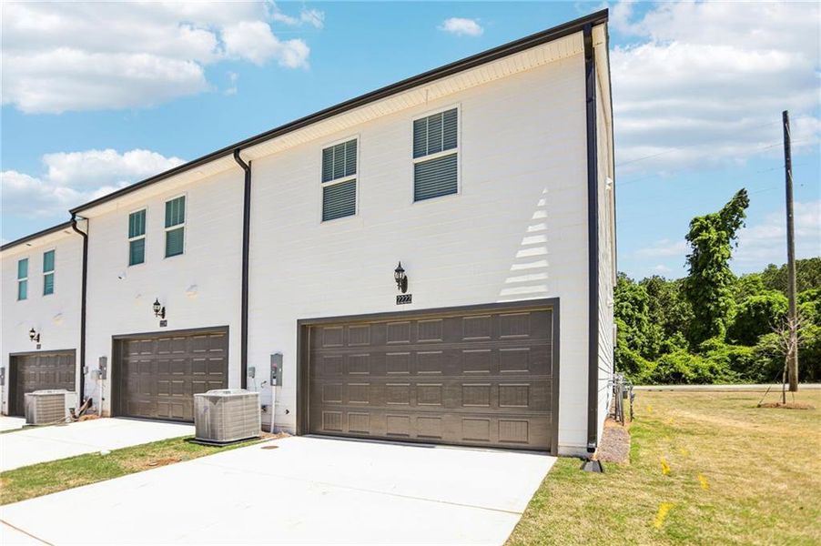 Front exterior of a new home in Avalon - Vista Series, Conyers, GA, highlighting curb appeal (Image 25).