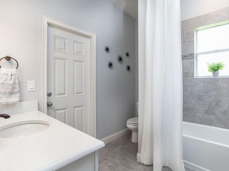 Convenient hall baths - Westin ll home plan by Highland Homes