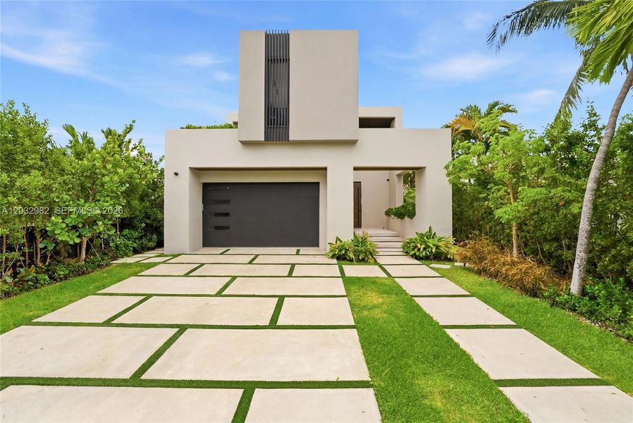 Front exterior of a new home in , Miami Beach, FL, highlighting curb appeal (Image 1). Front exterior of a new home in , Miami Beach, FL, highlighting curb appeal (Image 1).