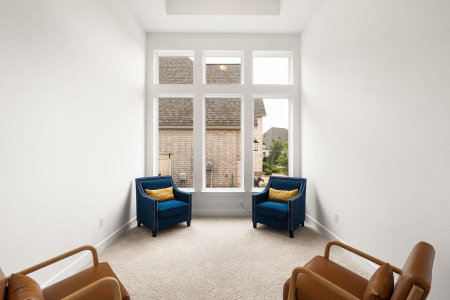 A quiet retreat with a wall of windows, inviting abundant natural light.