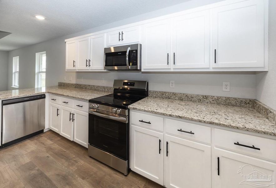 Furnished interior view inside a new home in Hidden Pines Estates, Milton (Image 5).