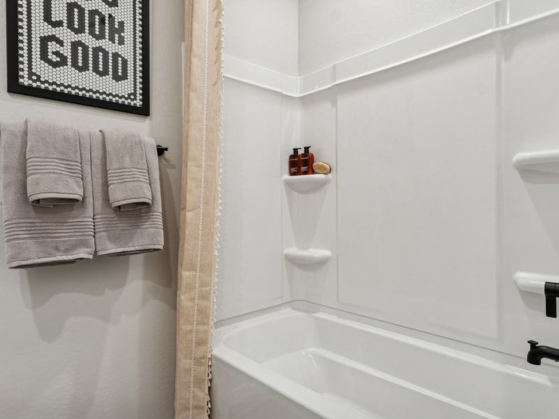 A bathroom with a toilet and sink.